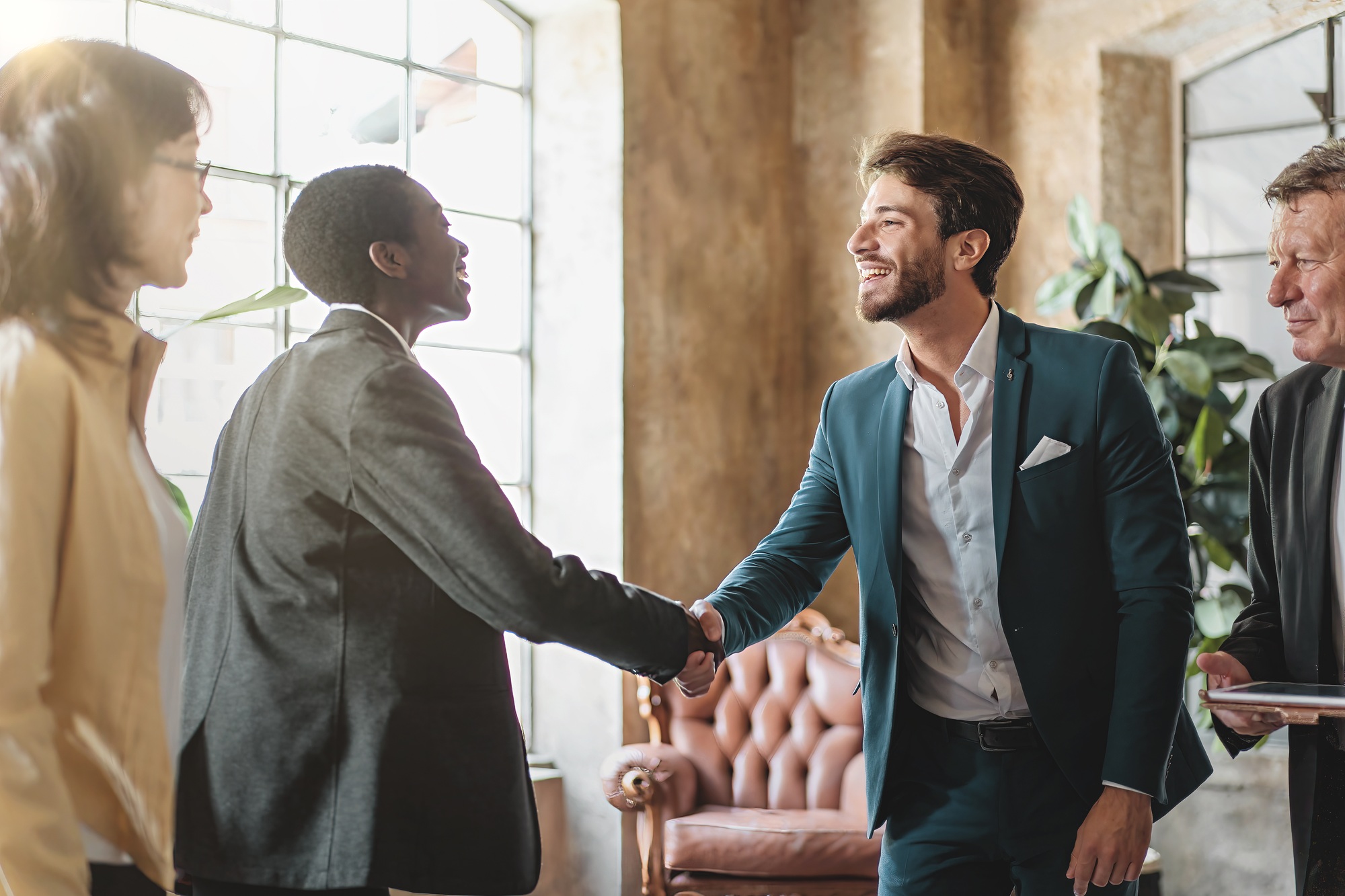 Business handshake in modern office